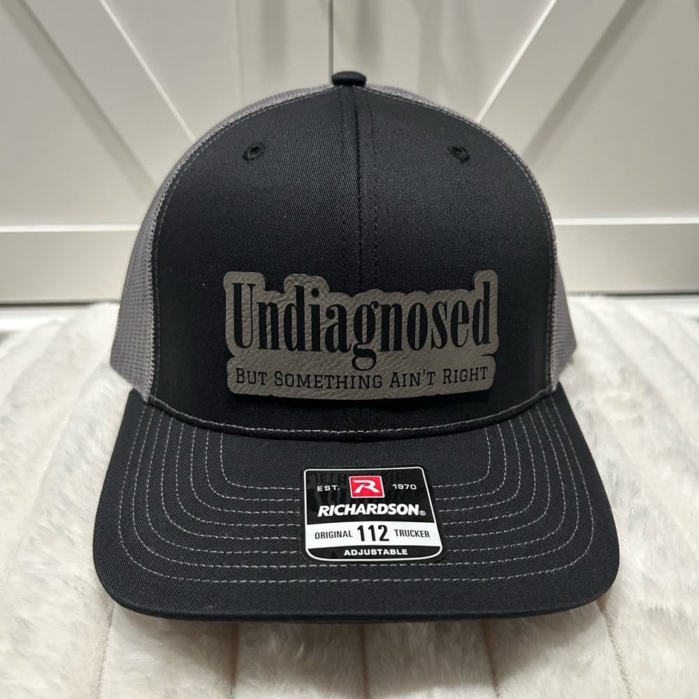 Undiagnosed, but something ain’t right. Laser engraved Richardson Trucker Hat.